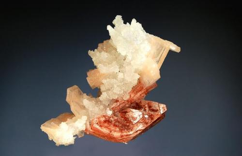 Heulandite
Jalgaon District, Maharashtra, India
3.9 x 5.7 cm.
Reddish heulandite crystals and pale salmon colored stilbite on drusy colorless chalcedony. (Author: crosstimber)