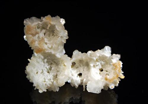 Stilbite
Pune, Mumbai District, Maharashtra, India
6.6 x 9.9 cm.
Underside of the above specimen showing the hollow rounded casts. There are also several square holes which were probably once filled with laumontite. (Author: crosstimber)