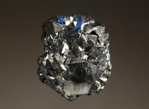 Skutterudite
Bou Azzer, Tazenakht, Ouarzazate Province, Morocco
2.3 x 2.4 cm.
Silvery metallic skutterudite crystals with a small cleavage of colorless calcite at the bottom. (Author: crosstimber)
