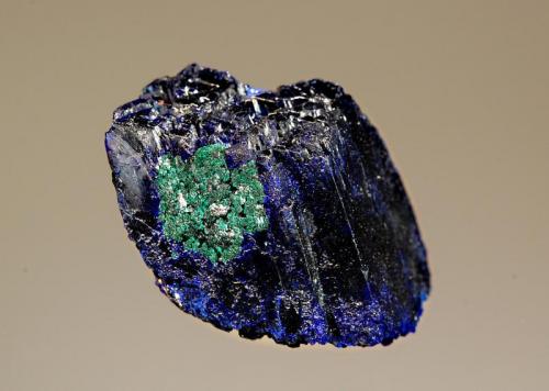 Azurite
Kerrouchene, Khenifra Province, Meknes-Tafilalet Region, Morocco
2.6 x 3.7 cm.
A single, dark blue azurite crystal with a small zone of malachite alteration. (Author: crosstimber)