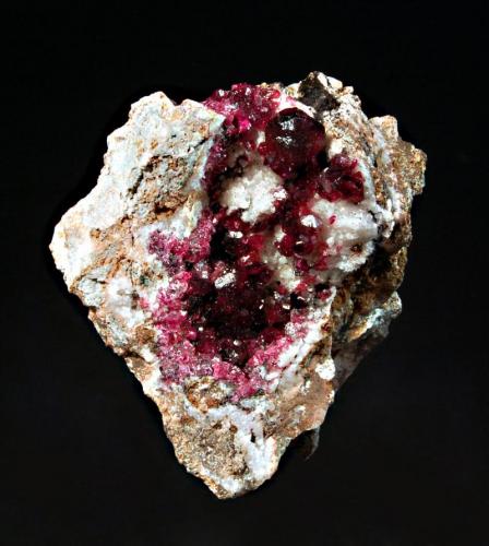 Wendwilsonite
Aghbar Mine, Bou Azzer, Tazenakht, Ouarzazate Province, Morocco
3.7 x 4.0 cm.
Lustrous, magenta wendwilsonite crystals lining a small cavity associated with contrasting white calcite. According to the dealer this was collected in 2000 and subsequent analysis showed it to be wendwilsonite. (Author: crosstimber)
