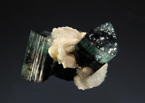 Elbaite
Sabsar, Haramosh Mts., Skardu District, Baltistan, Gilgit-Baltistan, Pakistan
2.0 x 2.5 cm.
Blue-zoned elbaites with albite. (Author: crosstimber)