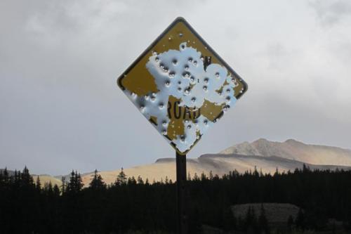 Looking east toward Mosquito Pass. Eventually we were delivered to the  cique to the right of the sign. (Author: vic rzonca)