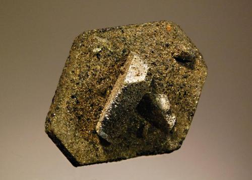 Epidote
Ras Koh Mts., Kharan District, Balochistan, Pakistan
4.7 x 5.3 cm.
Interpenetrating dark green pseudohexagonal epidote crystals coated with light green micro crystals of sphene and containing minor amounts of magnetite that render it 
magnetic. (Author: crosstimber)