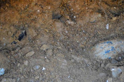 looking inside the pocket you can see mica rich clay and several smoky quartz crystals ready to be dug out (Author: thecrystalfinder)