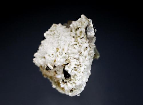 Anatase
Ras Koh Mountains, Kharan District, Balochistan, Pakistan
3.5 x 4.0 cm.
Sharp anatase crystals on a matrix of albite and quartz. (Author: crosstimber)