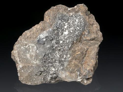 Sylvanite, Nagyagite
Baia de Arieş (Offenbánya), Alba Co., Romania
5,5x5x2,5 cm
Very rich and interesting specimen due to the rare association for the locale. Nagyagite is visible in minor lead gray leafs on the middle left. (Author: Simone Citon)