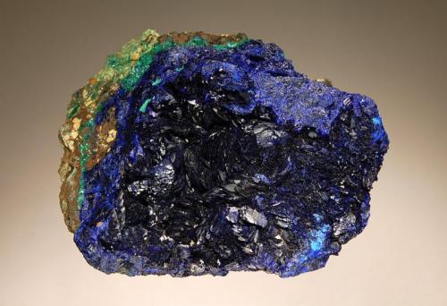 Azurite
Tongshan Mine, Guichi Dist., Anhui Province, China
5.3 x 8.5 cm.
Dark blue platy crystals to 1 cm lining a shallow cavity in massive azurite with minor malachite. (Author: crosstimber)