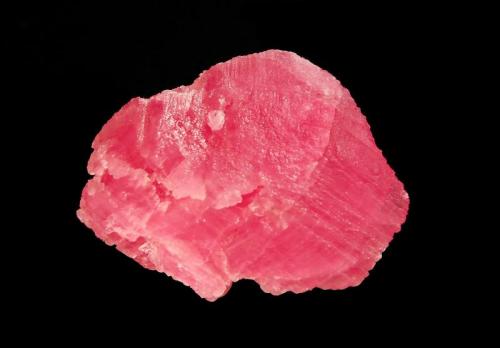 Rhodochrosite
Wutong Mine, Liubao, Cangwu Co., Guangxi Zhuang AR, China
3.1 x 4.0 cm.
A single flattened rhomb of reddish-pink rhodochrosite with a satiny luster. (Author: crosstimber)