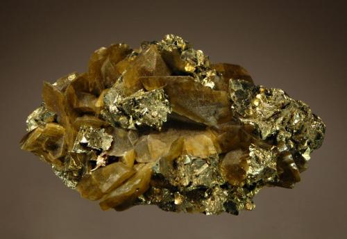 Siderite and chalcopyrite
Kaiwu Mine, Hezhang Co., Bijie Pref., Guizhou Prov., China
4.6 x 7.2 cm.
Semi-transluscent brown siderite rhombs to 2 cm interspersed among brassy chalcopyrite crystals. Thanks to Berthold Ottens and Jordi for making the true location of these specimens known. (Author: crosstimber)
