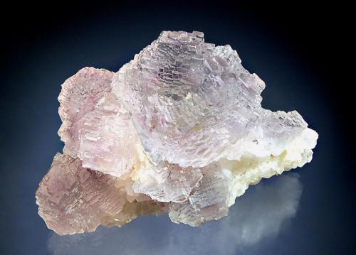 Fluorite
Shangbao Mine, Leiyang Co., Hunan Prov., China
4.3 x 6.8 cm
Pale purple, cuboctahedral, multi-stepped crystals with light green cores. Mined in 2008. (Author: crosstimber)