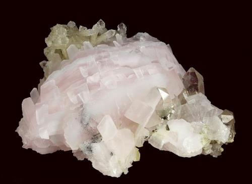 Calcite ( var. Manganoan ) with Quartz
Huanggangliang Fe mine, Kèshíkèténg Qí, Chifeng Prefecture, Inner Mongolia A.R., China

92 x 71 x 52 mm

Bright light pink manganoan-Calcite to 55 x 40 x 7 mm with light-smoky Quartz scepters to 14 mm (Author: GneissWare)