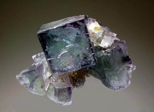 Fluorite
Chashan Mine, Linwu Co., Chenzhou Pref., Hunan Prov., China
4.5 x 6.0 cm
Intergrown group of gemmy bluish-green fluorite crystals resting on a crystallized quartz matrix. (Author: crosstimber)