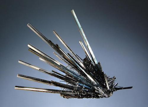 Stibnite
Xikuangshan Mine, Lengshuijiang Co., Loudi Pref., Hunan Prov., China
6.5 x 8.5 cm.
Slender lustrous stibnite crystals emanating from a central point with a second generation of smaller crystals growing along the lower half of the prism. (Author: crosstimber)