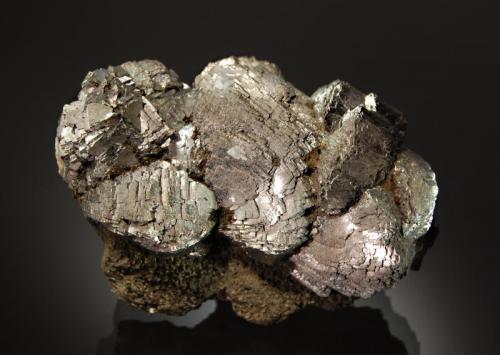 Arsenopyrite
Huanggang Mine No. 2, Keshiketeng Co., Chifeng Pref., Inner Mongolia AR, China
5.7 x 7.7 cm
Radial aggregates of silvery metallic arsenopyrite crystals on a green hedenbergite.matrix. (Author: crosstimber)