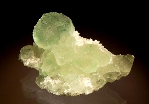 Fluorite
Xiefang Mine, Ruijin Co., Ganzhou Pref., Jiangxi Prov., China
4.8 x 7.0 cm
Mint green cuboctahedral fluorite crystals on a matrix of quartz. (Author: crosstimber)