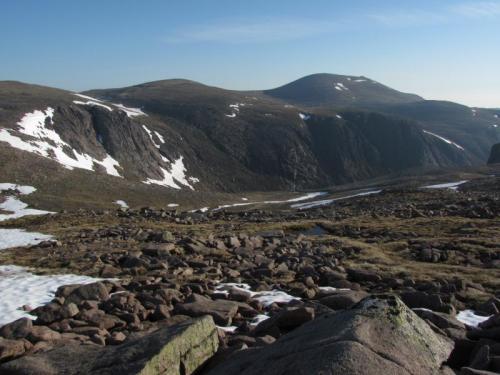 The Cairngorms in early June this year. Still quite a lot of the winter’s snow about. On the plus side there were no midges. The mountain in the distance is called ’Cairngorm’, after which the range of mountains is named. It’s summit is 1244m, over 4,000 ft above sea level. Everywhere is granite. (Author: Mike Wood)