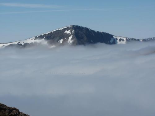 The Angel’s Peak across the cloud inversion. A flock of 24 geese flying southward, honking occasionally. (Author: Mike Wood)