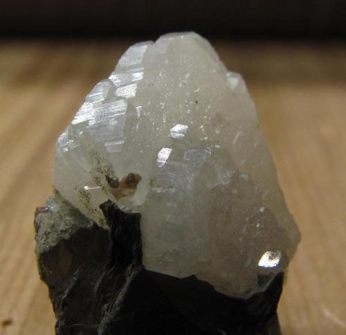 Phenakite
Ben Macdui, Cairngorm Mountains, Grampian Region, Scotland, UK
15mm x 13mm x 7mm crystal
And again. Apologies for the multiple photo’s but it’s the only specimen I have! Besides, there’s a lot of little reflective faces to scrutinise. Looks very much like albite, but it scratches quartz - and quartz does not scratch it. (Author: Mike Wood)