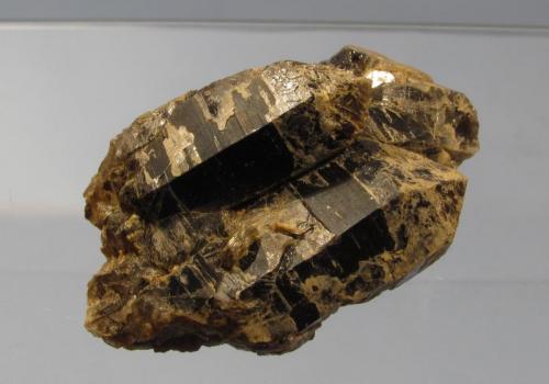 Smoky Quartz
Ben a’ Bhuird, Cairngorm Mountains, Grampian Region, Scotland, UK
55mm x 35mm 25mm
Small group of crystals with a little muscovite mica, from the same locality as the previous specimen. (Author: Mike Wood)