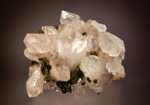 Quartz
Hongquizhen Quarry, Meigu, Liangshan Pref., Sichuan Prov., China
7.5 x 9.0 cm
Bladed, dark green epidote crystals scattered over a matrix of quartz crystals. (Author: crosstimber)