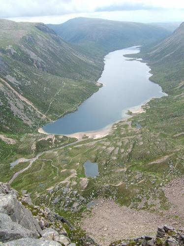View of Loch Avon from the top of Shelter Stone Crag, looking East. The cliff below is about 800ft (~250m). All granite of course. And no, I didn’t climb up it to get here! (Author: Mike Wood)