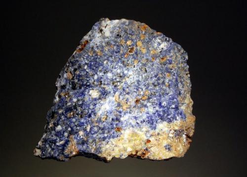 Sodalite
Princess Quarry, Dungannon Township, Hastings Co., Ontario, Canada
7.0 x 7.8 cm
Massive blue sodalite associated with yellow cancrinite and small grains of black biotite. (Author: crosstimber)
