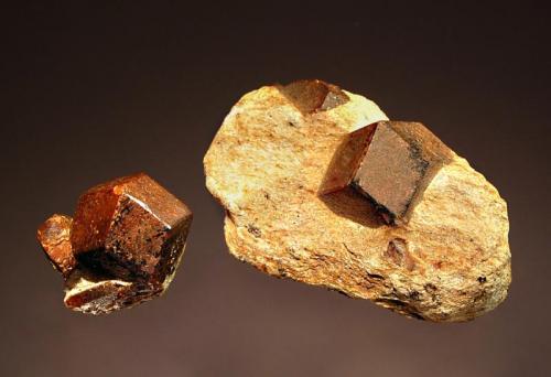 Almandine
Green Garnet Mine, Roxbury, Litchfield Co., Connecticut, USA
2.0 cm
Sharply-formed brown dodecahedrons in light tan schistose matrix. (Author: crosstimber)