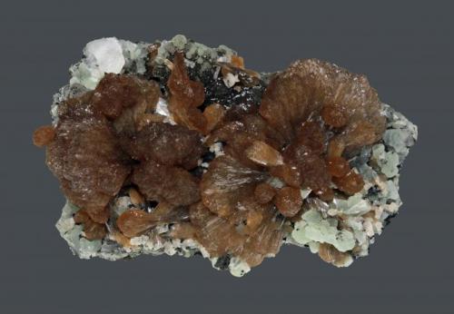 Stilbite
Prospect Park Quarry, Prospect Park, Passaic County, New Jersey, USA
9.7 x 6.2 cm
Lustrous, chocolate stilbite with prehnite and calcite (Author: Frank Imbriacco)