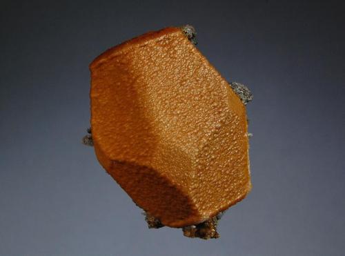 Siderite ps. calcite
Broken Hill Mine, Aggeneys, N. Cape Prov., South Africa
4.3 x 5.1 cm
A barrel-shaped, hollow, brown prism of siderite/sphalerite pseudomorphing calcite. (Author: crosstimber)