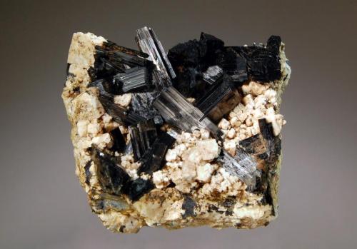 Arfvedsonite
Mt. Malosa, Zomba District, Malawi
5.3 x 6.0 cm
Prismatic, bladed, black arfvedsonite crystals on a partially decomposed 
feldspar matrix. (Author: crosstimber)