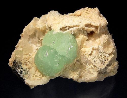 Prehnite
Goboboseb Mts., Brandberg area, Erongo Region, Namibia
5.5 x 7.1 cm
Two mint green spheres of prehnite implanted on a calcite and quartz matrix. (Author: crosstimber)