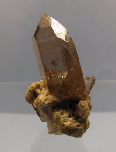 Smoky Quartz
Aiguille du Moine, Mont-Blanc massif, France
specimen 33mm tall
Smoky quartz crystal is 22mm tall x 15mm x 10mm, on a feldspar/granite matrix.
Found in a narrow cleft in the end of an old crystal cave, in 1991. (Author: Mike Wood)