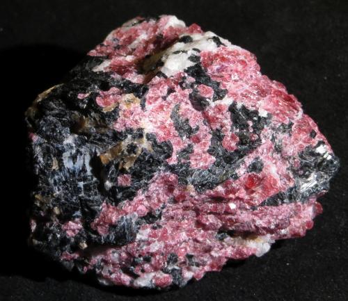 Eudialyte, Aegirine
Mont Saint-Hilaire, Canada
4,5 x 4 x 4 cm
Many of the minerals originally described from Ilímaussaq or the Kola complexes were later also reported from Mont Saint-Hilaire, although I have the impression that mostly in micros. 

I highly recommend the album of Doug Merson here in the FMF where we have many gorgeous micros from there. (Author: kakov)