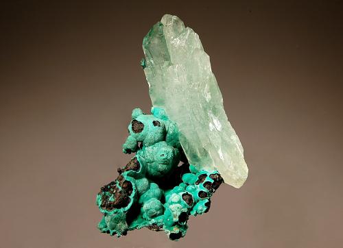 Barite
Shangulowé Mine, Kambove District, Katanga Prov., DR Congo
3.7 x 4.0 cm
Parallel growth of colorless doubly terminated barite crystals tinted with 
inclusions of malachite. (Author: crosstimber)