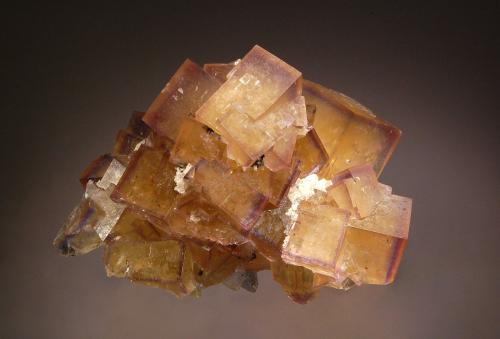 Fluorite
Frohnau, Annaberg-Buchholz, Erzgebirge, Saxony, Germany
5.5 x 8.0 cm
Cubic yellow fluorite crystals with zones of bluish purple on the edges. (Author: crosstimber)