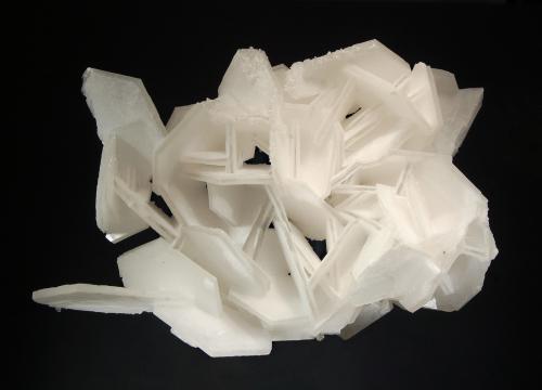 Calcite
Yangshan Co., Qingyuan Pref., Guangdong Prov., China
5.7 x 9.8 x 14.9 cm
Poker chip calcites with opaque white layers that sandwich clear central zones. The edges and back sides of the crystals are coated with tiny clear fluorite crystals. (Author: crosstimber)