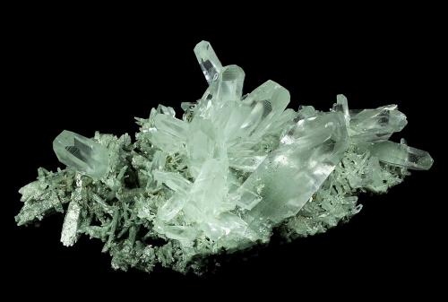 Quartz
L’Alpe d’Huez, Bourg d’Oisans, Isère, Rhone-Alpes Region, France
150 x 92 x 62 mm

Gemmy Quartz crystals to 54 x 20 mm, with a slightly satiny luster, are perched on a base of green Chlorite(?)-included Quartz. (Author: GneissWare)