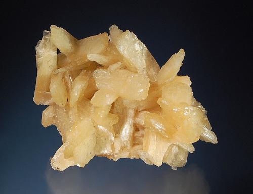 Stilbite
Amudikha River,Evenkia, Krasnoyarsk Kray, Yakutia, Russia
4.6 x 5.7 cm
A small cluster of intergrown lustrous bladed tan crystals. (Author: crosstimber)