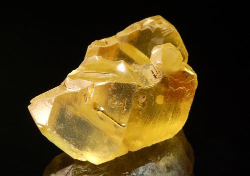 Sulfur
Vodinskoye deposit, Samaraskaya Oblast, Povolzhsky Region Russia
4.0 x 4.5 cm
A floater group of lemon yellow sulfur crystals with minor bitumen. (Author: crosstimber)