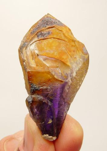 Quartz variety amethyst.
Brandberg Area, Erongo, Namibia
53 x 29 x 20 mm
A batch of these ’mysterious’ quartz crystals with a yellow coating that can not be removed with the usual acids and small unknown crystals, surfaced in the first few years of this century and apparently not again. (Author: Pierre Joubert)