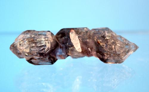 Quartz var amethyst var smoky
Goboboseb Mountains, Brandberg Area, Erongo Region, Namibia
5.8 x 1.7 cm
Double terminated amethyst and smoky quartz scepter (Author: Don Lum)