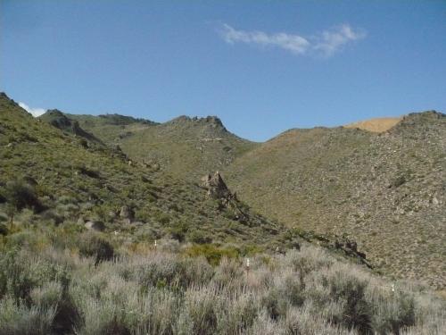 You can see some of the road ahead in the far distance, and part of the mine which is light brown in color (Author: John S. White)