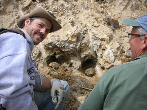 Ian Merkel, an exposed quartz pocket, and Scott Werschky.  Ian is a senior geologist working at FMI-Climax’s Henderson mine (Mo) in Colorado, and Scott is a noted mineral dealer known as Mr. Round Mt. gold boy. (Author: Tony L. Potucek)