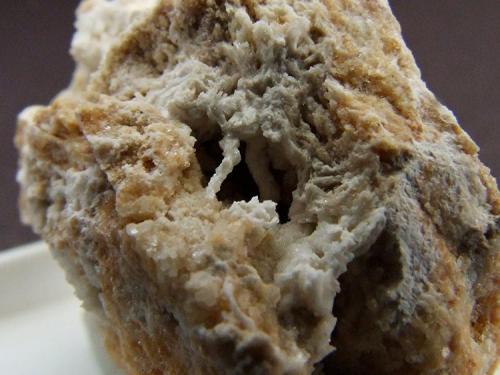 Baryte (possibly) with Calcite.
Unnamed dump below Dam Rigg Level, Arkengarthdale, North Yorkshire, England, UK.
whole sample measures 25 mm across (Author: nurbo)