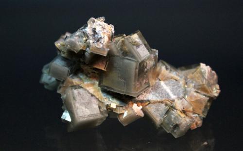 Fluorite
Huangshaping Mine, Guiyang Co., Chenzhou, Hunan Province, China
7.3 x 4.0 cm
Zoned cubes of green fluorite with sand inclusions (Author: Don Lum)