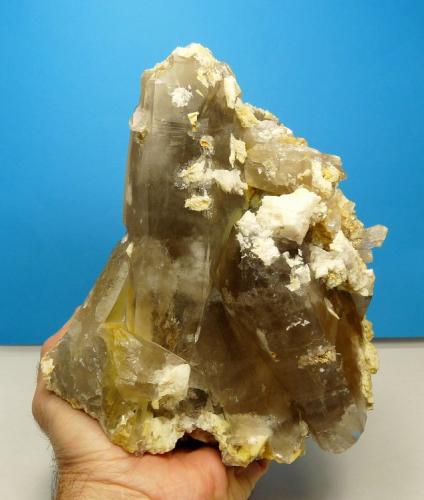 Quartz var. smoky, feldspar, dolomite and rutile
Van Rhynsdorp, Western Cape South Africa.
195 x 160 x 130 mm
One of the larger specimens of quartz that I collected. It weighs just more than 3 kg. (Author: Pierre Joubert)