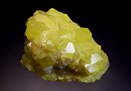 Sulfur
Racalmuto Mine, Agrigento Prov., Sicily, Italy
5.5 x 6.7 cm
Bright lemon yellow sulfur crystals associated with white aragonite crystals which exhibit pink fluorescence under LW and SW light. (Author: crosstimber)