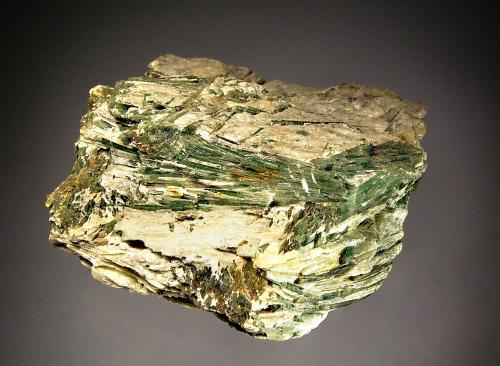 Actinolite
Roccamonfina, Caserta, Campania, Italy
6.5 x 7.0 cm
Bundles of acicular olive-green actinolite embedded in white talc. (Author: crosstimber)