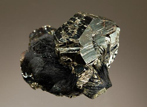 Pyrite
Rio Marina, Elba Island, Livorno Prov., Tuscany, Italy
4.5 x 4.8 cm
A matrix of micaceous hematite hosts a lustrous crystal of pyrite. (Author: crosstimber)